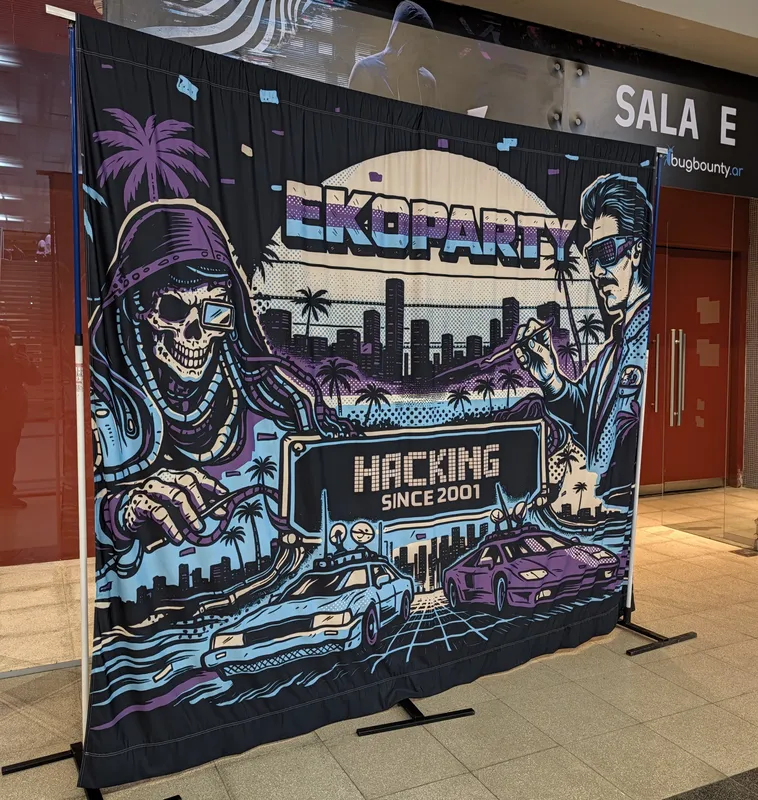 The Ekoparty backdrop: a skeleton hacker and a retro cityscape around the words "Hacking since 2001"